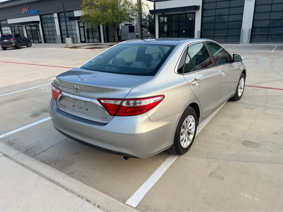 Silver Camry rear quarter from the listing